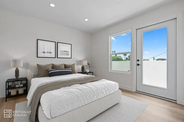 a bedroom with a bed and a painting