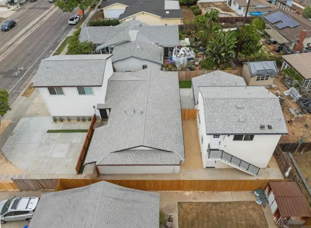 an aerial view of residential houses with outdoor space