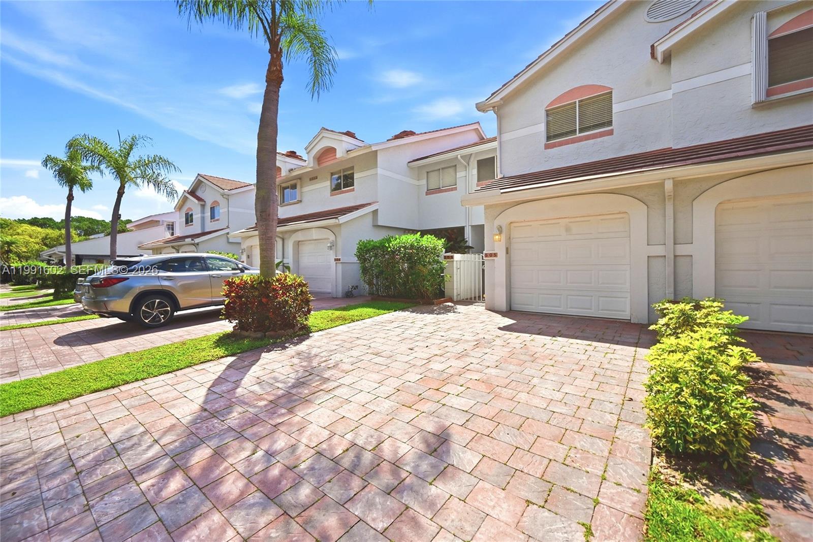 6215 Old Court Road, Unit 505 Boca Raton, FL 33433 - Photo 2 of 36 a front view of a house with garden