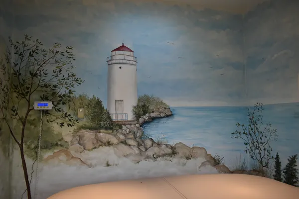 a view of a room with wooden floor and windows