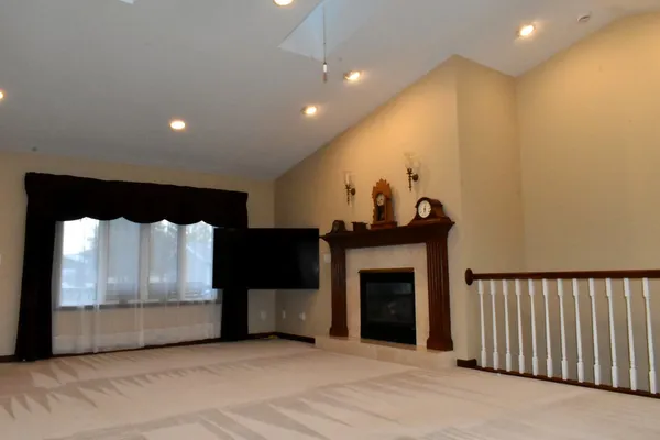 a view of a livingroom with furniture and a chandelier