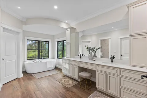 a bath tub sitting next to a window