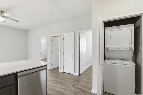 a view of a storage & utility room with closet dryer and washer