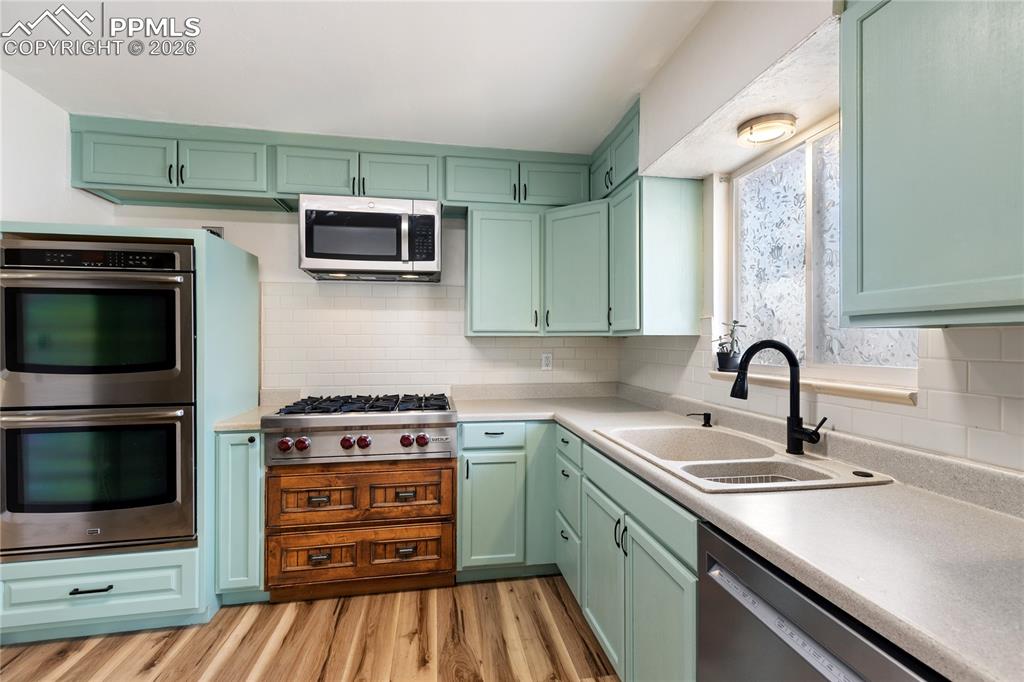 528 Rowe Lane Colorado Springs, CO 80911 - Photo 11 of 38 a kitchen with a sink and steel appliances