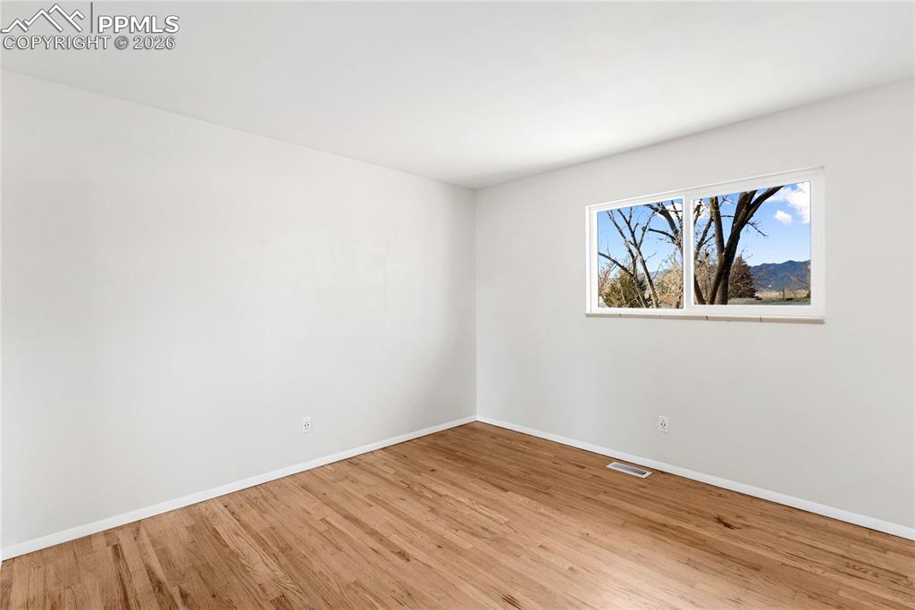528 Rowe Lane Colorado Springs, CO 80911 - Photo 14 of 38 a view of a room with wooden floor