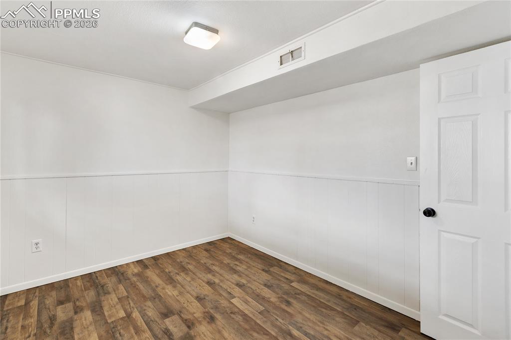 528 Rowe Lane Colorado Springs, CO 80911 - Photo 29 of 38 a view of a room with wooden floor