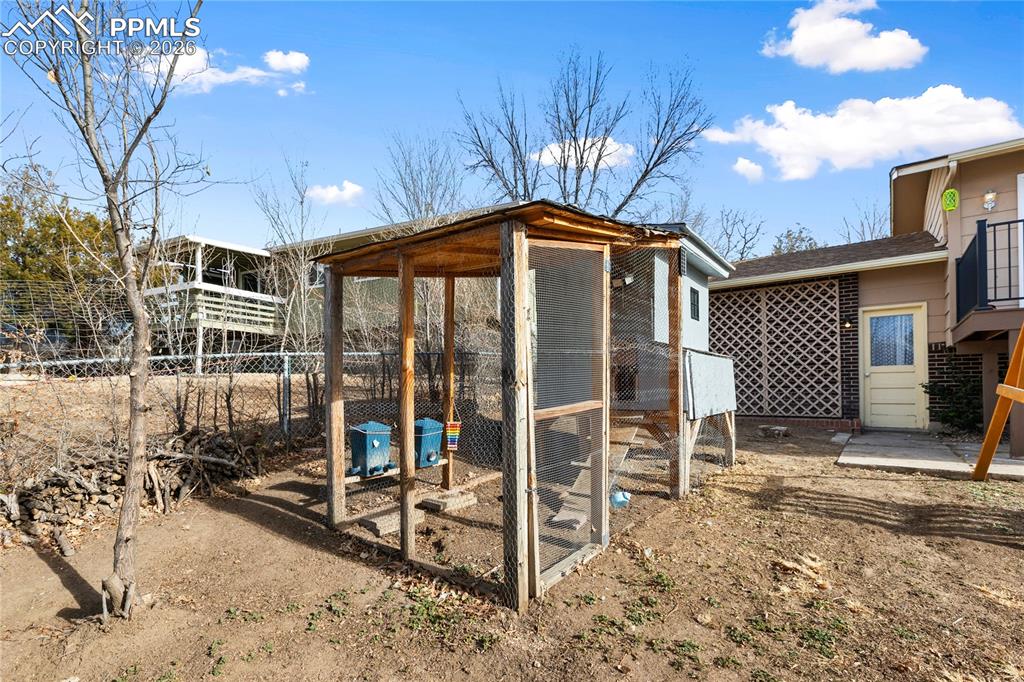 528 Rowe Lane Colorado Springs, CO 80911 - Photo 37 of 38 a front view of a house with a yard