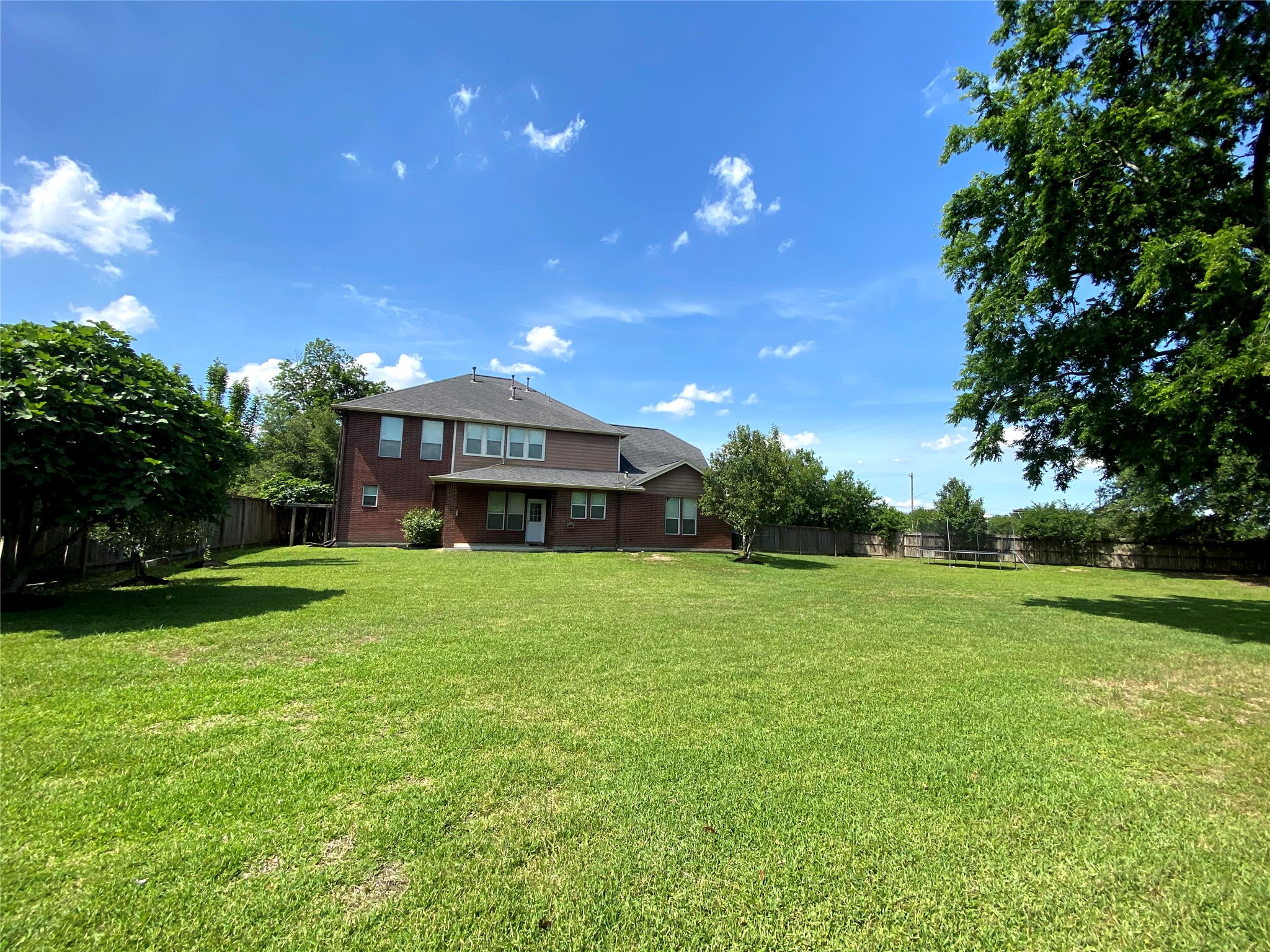 12122 Ross Road Houston, TX 77034 - Photo 2 of 16 Good View of the available Lot to be divided. Custom home NOT PART OF THIS LISTING seller may consider selling for the right price.