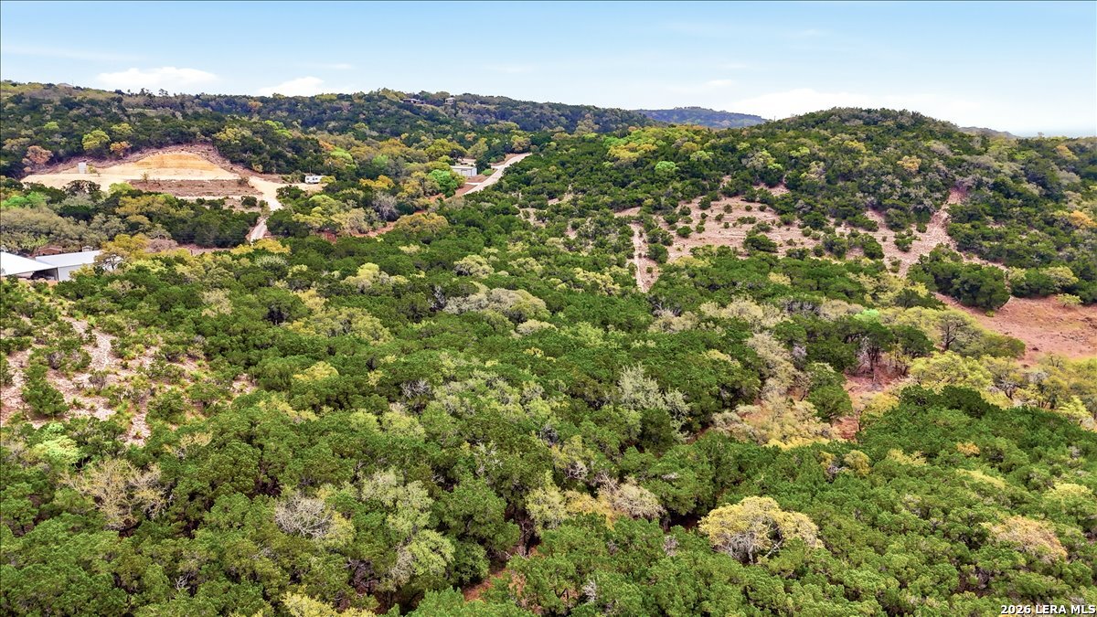 105-109 West Winding Loop Boerne, TX 78006 - Photo 16 of 34 a view of a houses with a lush green hillside