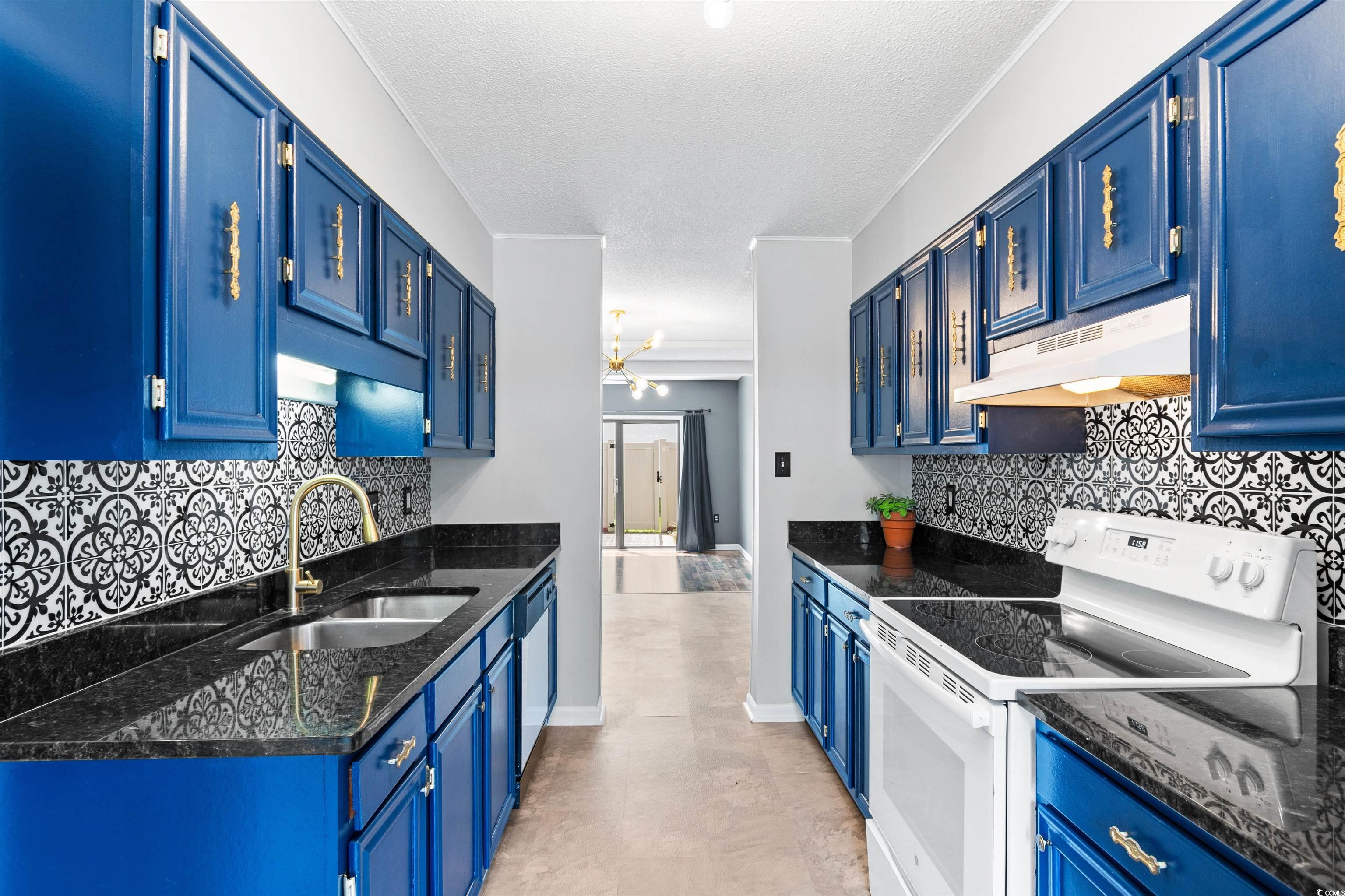 Kitchen featuring light tile patterned flooring, w