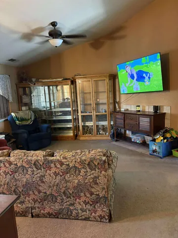 a bathroom with a double vanity sink a toilet and a mirror