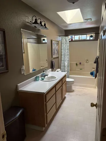 a bed room with bed and window