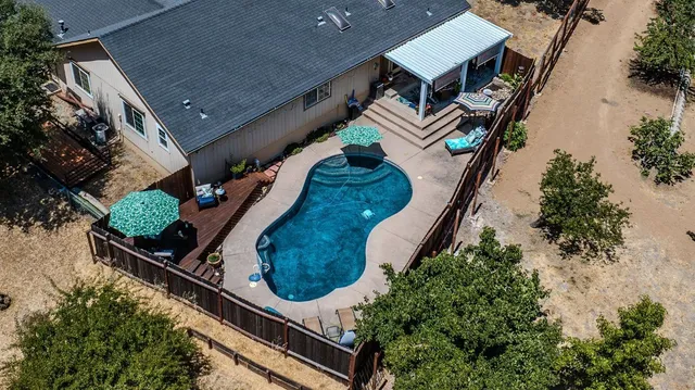 an aerial view of house with a yard
