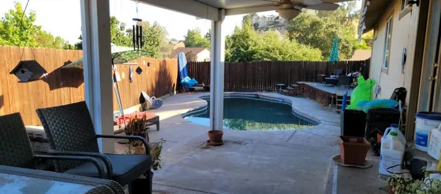 a view of a house with a snow in the yard