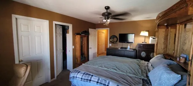 a living room with furniture rug and floor to ceiling window