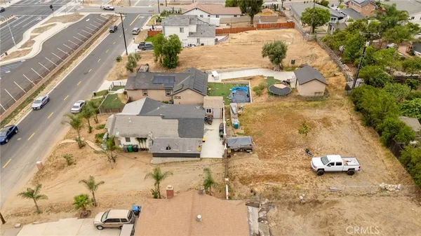 a aerial view of residential houses with outdoor space