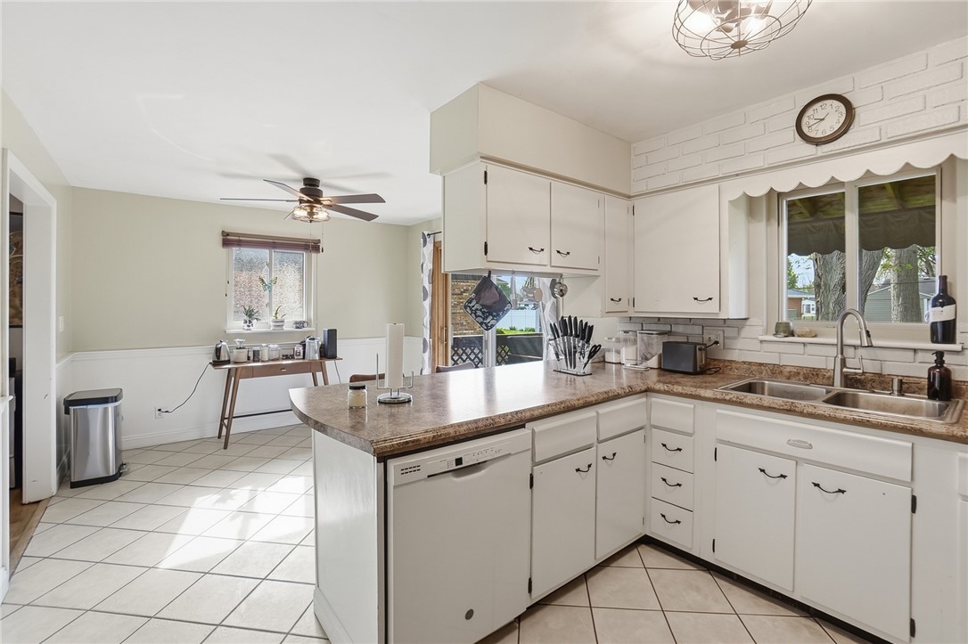 150 Littlejohn Road Troy, OH 45373 - Photo 12 of 40 This spacious kitchen offers ample counter space and an inviting atmosphere perfect for culinary endeavors.