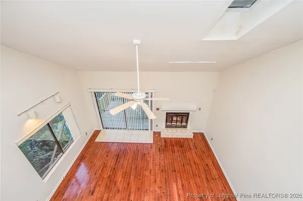 a view of a living room with wooden floor