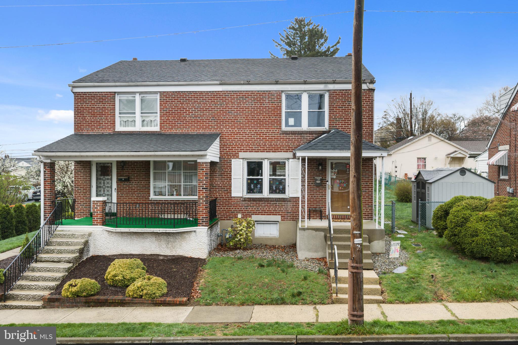 front view of a house with a yard