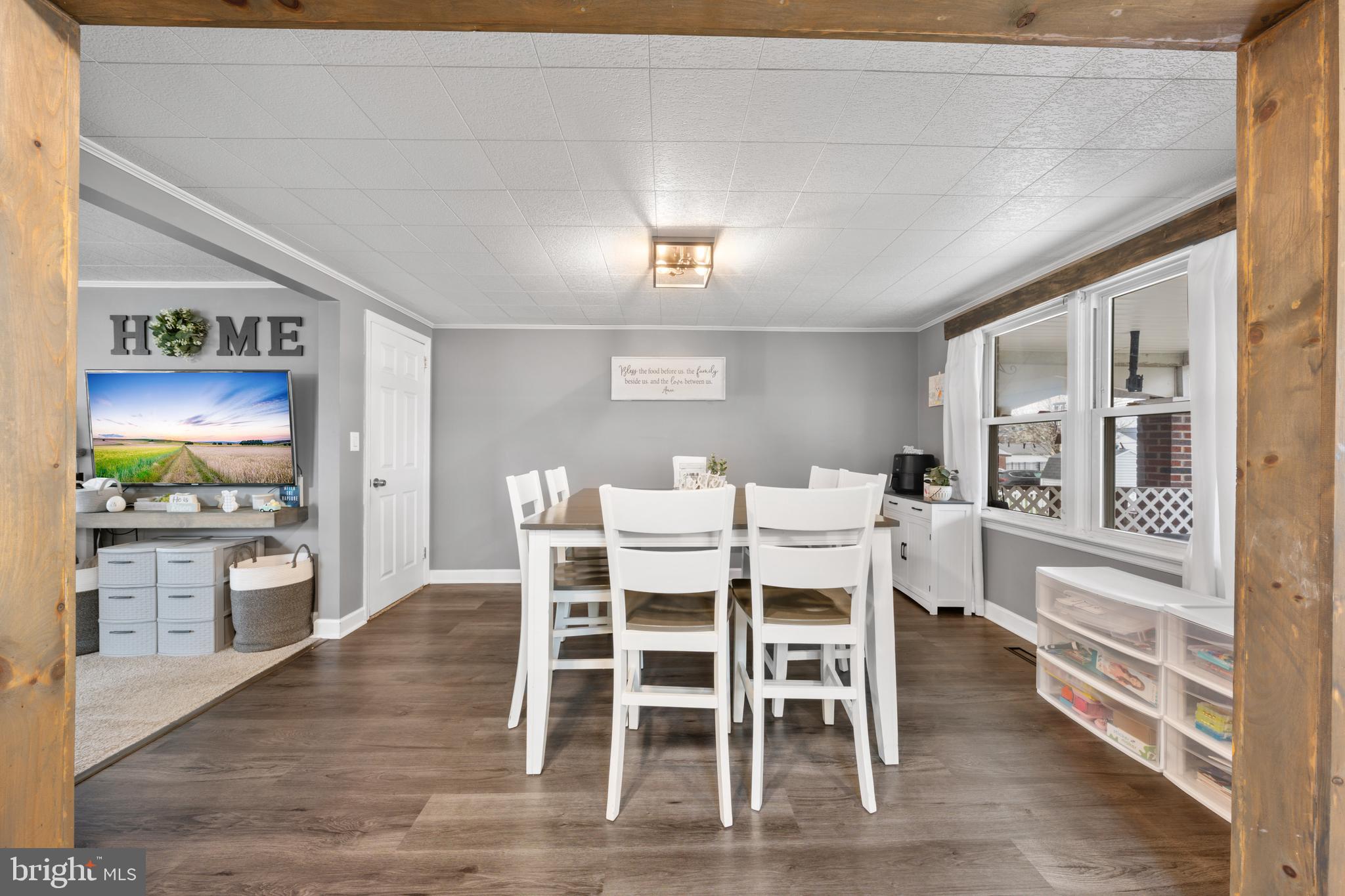 240 5th Street Whitehall, PA 18052 - Photo 11 of 43 a view of a dining room with furniture a chandelier and wooden floor