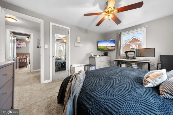 a bedroom with furniture and a chandelier