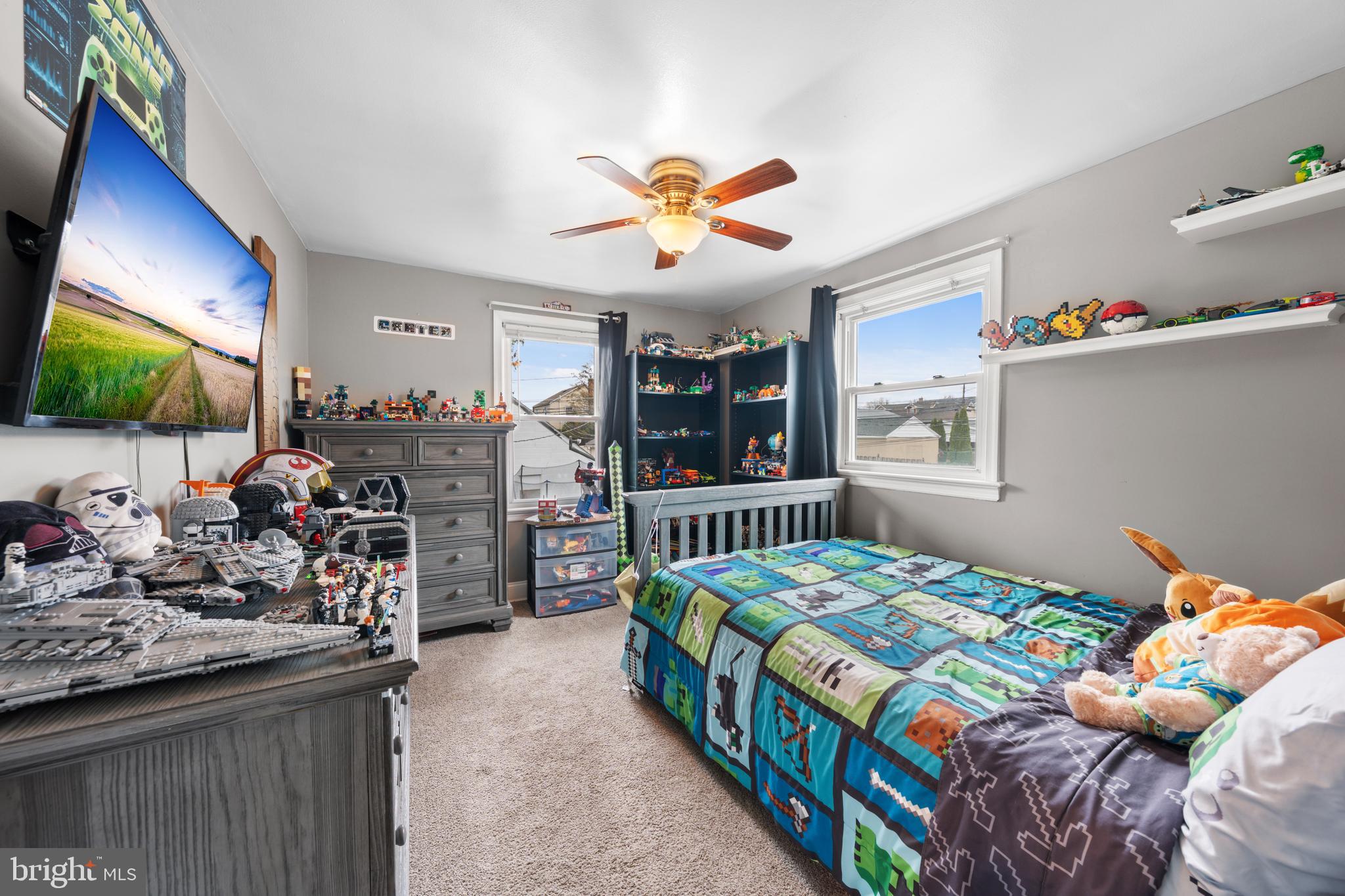 240 5th Street Whitehall, PA 18052 - Photo 17 of 43 a bedroom with a bed and a flat tv screen on dresser