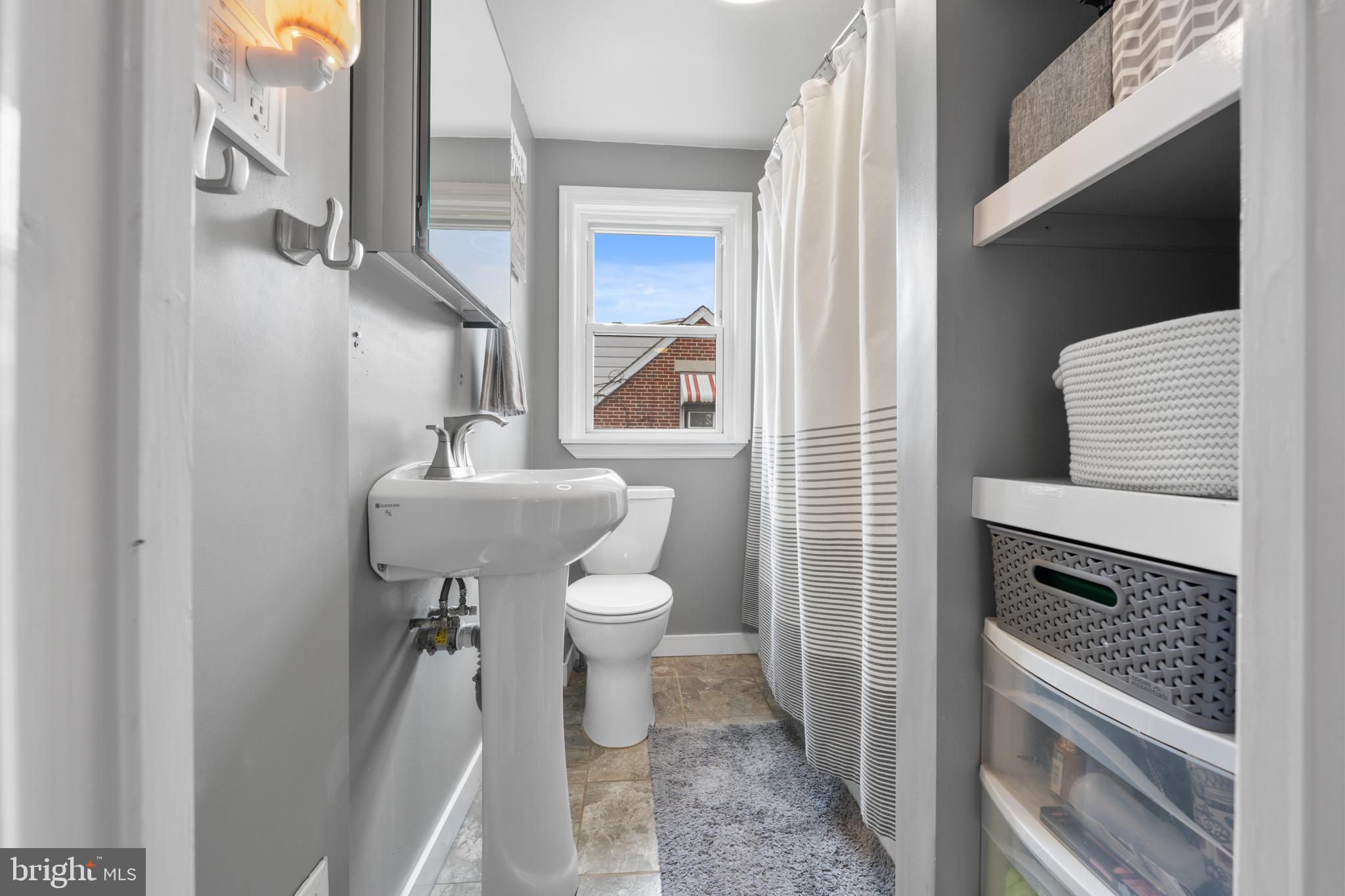 240 5th Street Whitehall, PA 18052 - Photo 21 of 43 a bathroom with a toilet sink and mirror