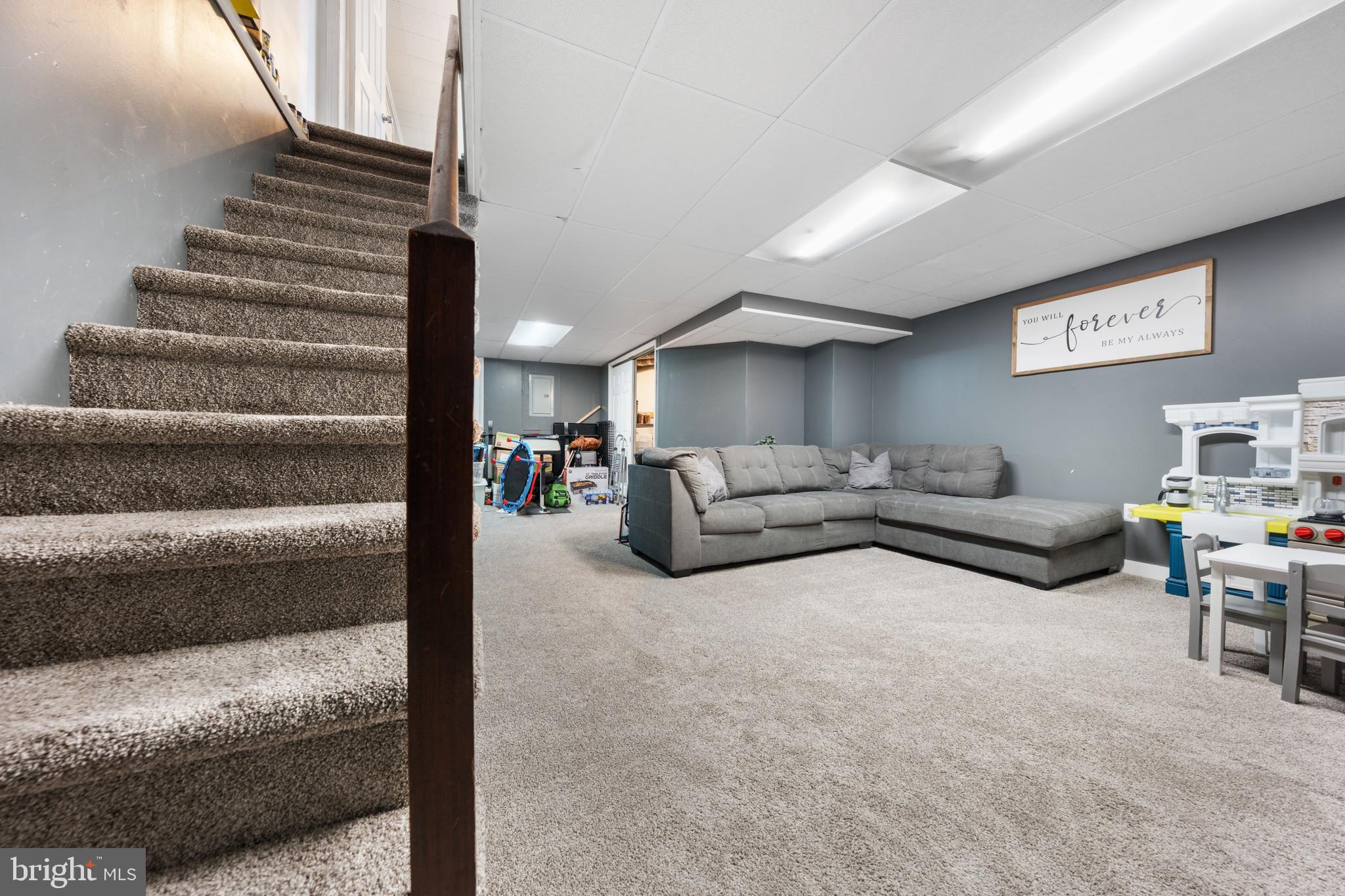 240 5th Street Whitehall, PA 18052 - Photo 22 of 43 a living room with furniture and a dining table with wooden floor