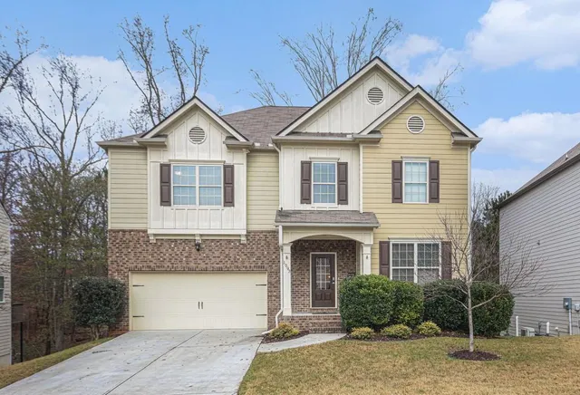 a front view of a house with garden
