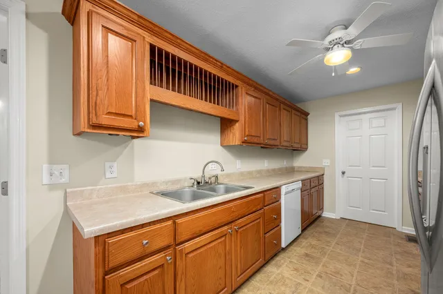 a kitchen with a sink cabinets and appliances