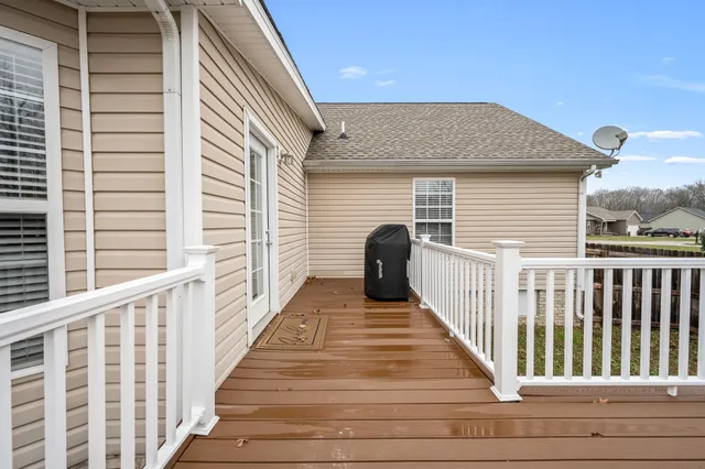 a view of a balcony with wooden floor
