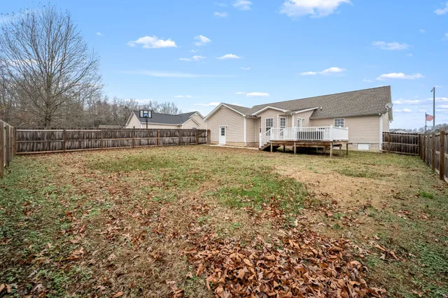 a house with trees in the background