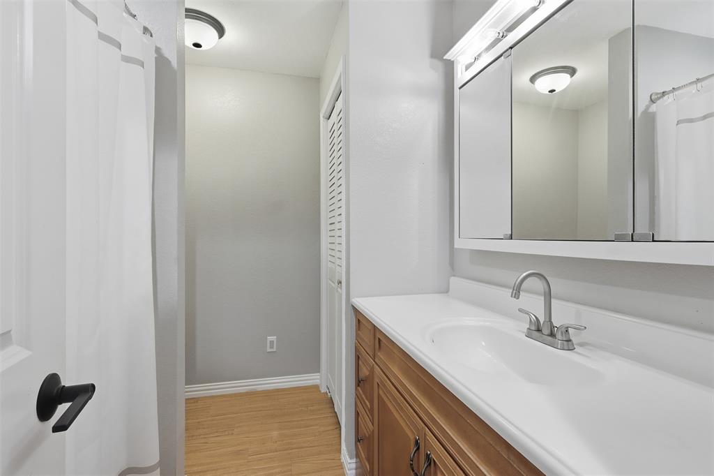 397 Rs County Road 4452 Point, TX 75472 - Photo 15 of 34 a bathroom with a sink and a mirror