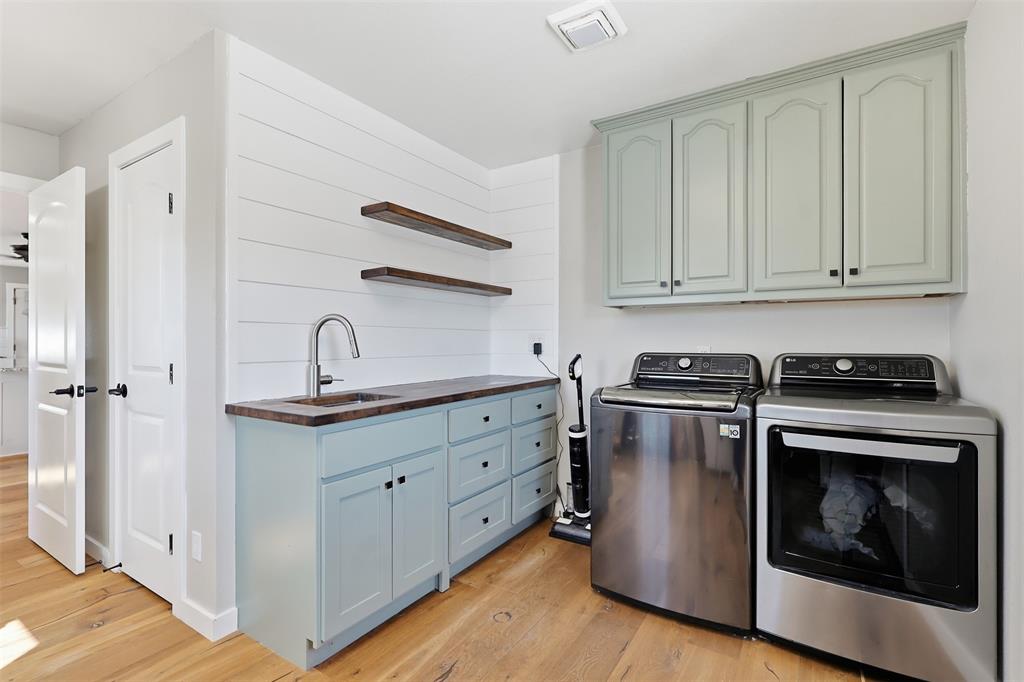 397 Rs County Road 4452 Point, TX 75472 - Photo 16 of 34 a kitchen with granite countertop white cabinets and a stove with wooden floors