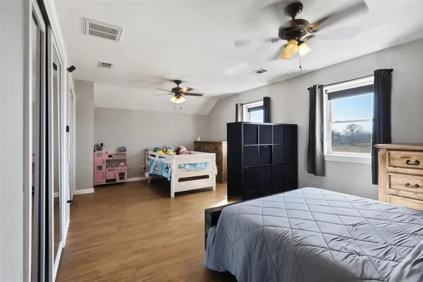 a bedroom with a bed and a closet