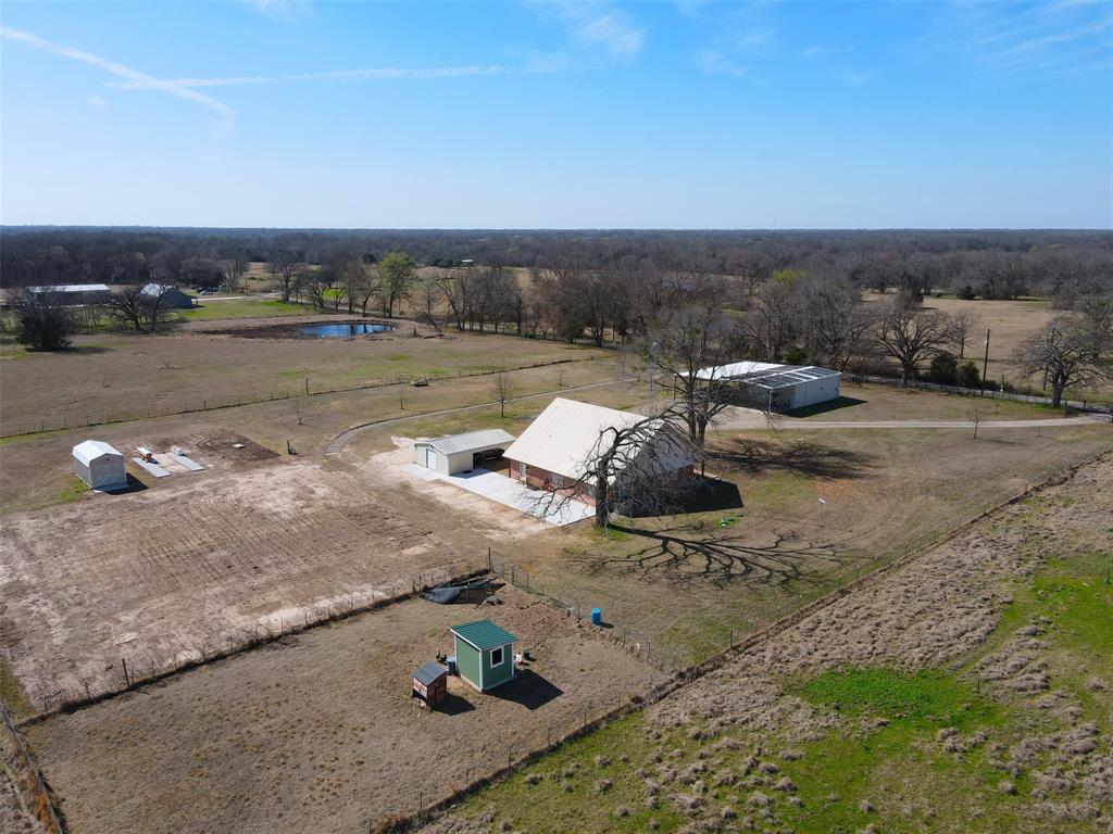 397 Rs County Road 4452 Point, TX 75472 - Photo 25 of 34 an aerial view of a house with a yard and lake view