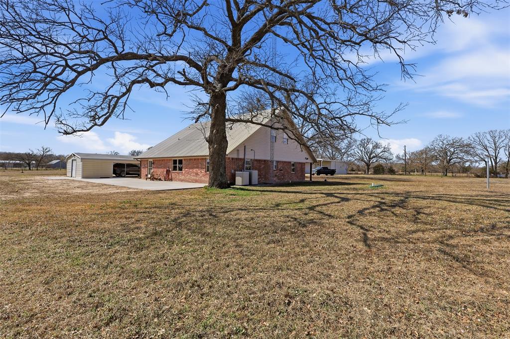 397 Rs County Road 4452 Point, TX 75472 - Photo 30 of 34 a front view of a house with a yard