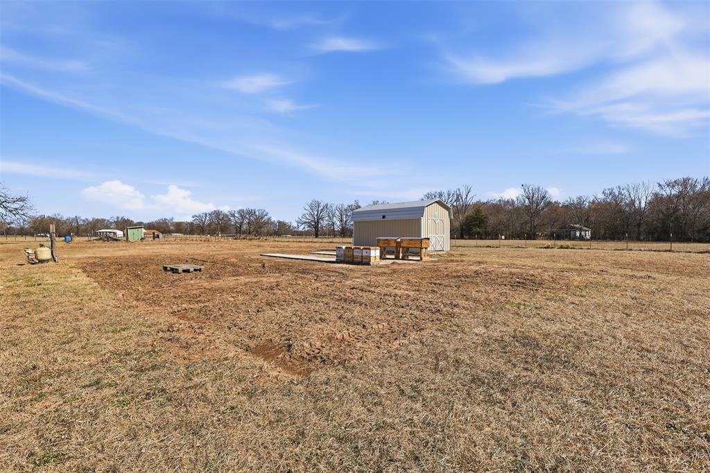 397 Rs County Road 4452 Point, TX 75472 - Photo 33 of 34 a view of a lake with houses in the back