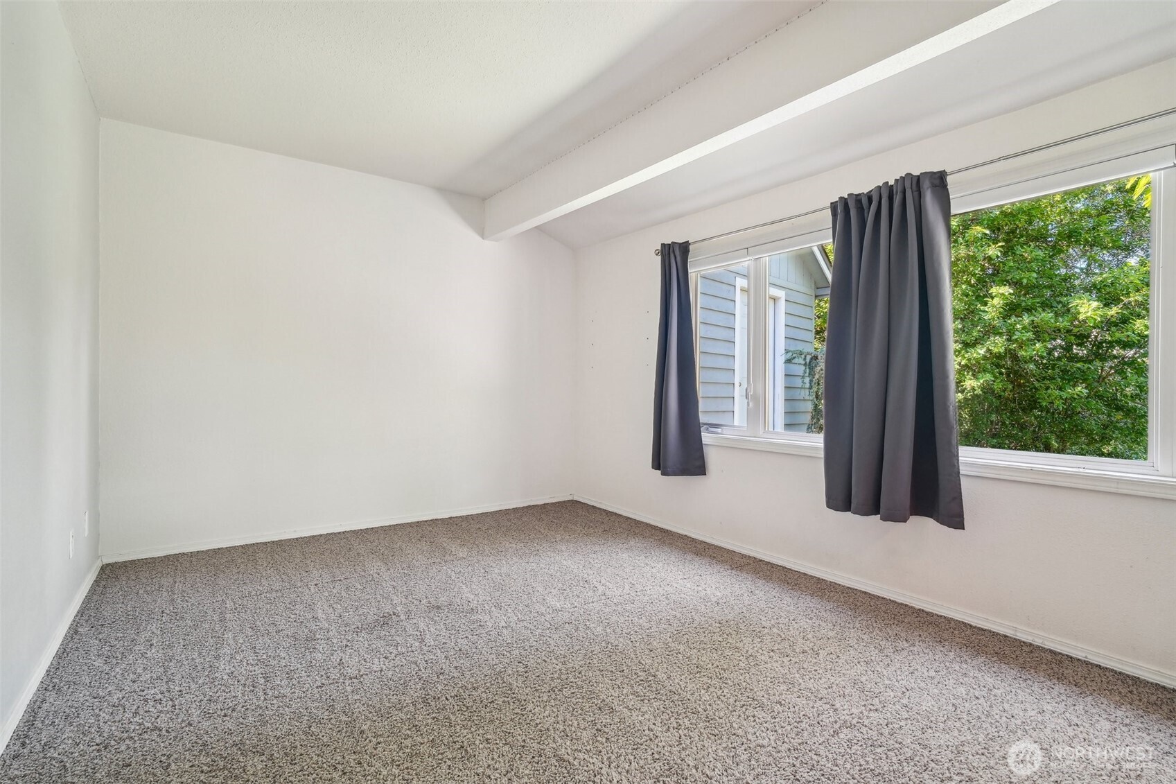 11112 East Riverside Drive Bothell, WA 98011 - Photo 28 of 35 an empty room with large windows and a yard