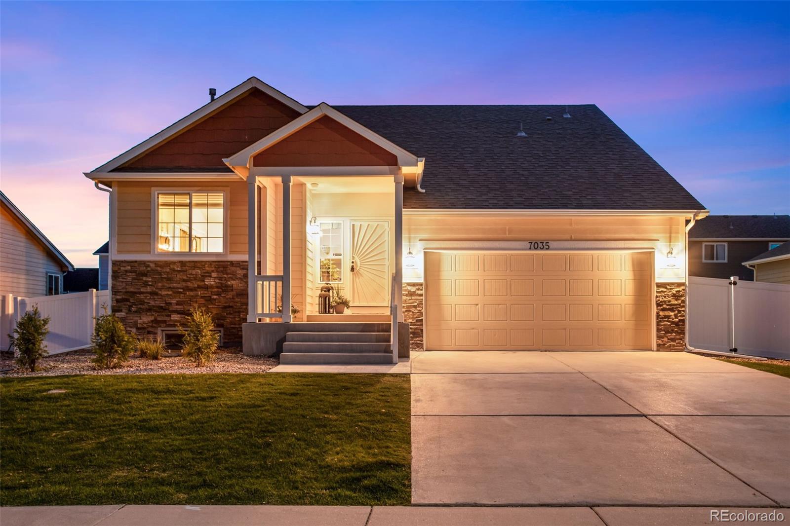 7035 McClellan Road Wellington, CO 80549 - Photo 5 of 43 a front view of a house with a yard