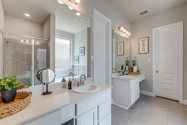 a room with sink and mirror