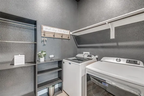 a utility room with dryer and washer