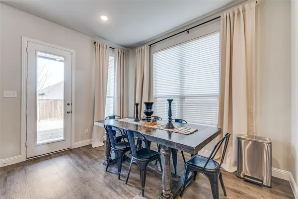 a view of a dining room with furniture and window