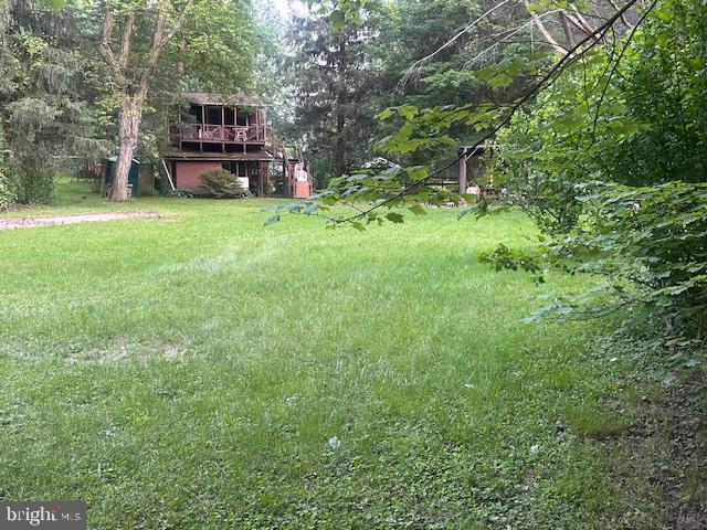 270 Pharr Road Everett, PA 15537 - Photo 28 of 40 a view of a house with truck parked in the forest