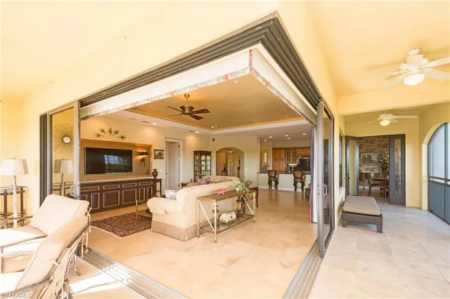 a bedroom with furniture and a flat screen tv