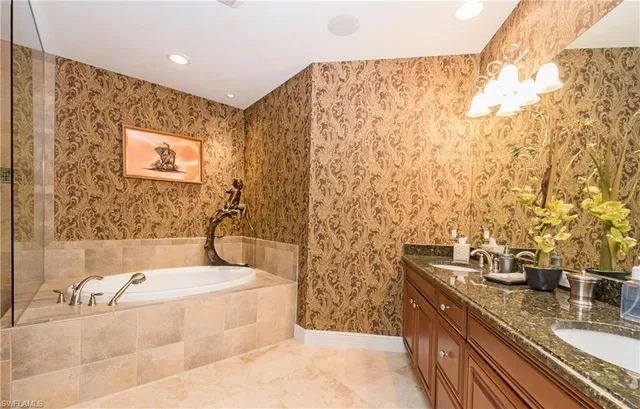 a bathroom with sink shower and bathtub