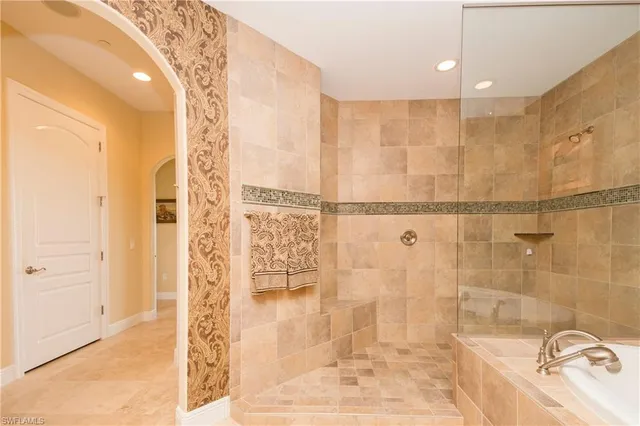a bathroom with a bathtub and shower