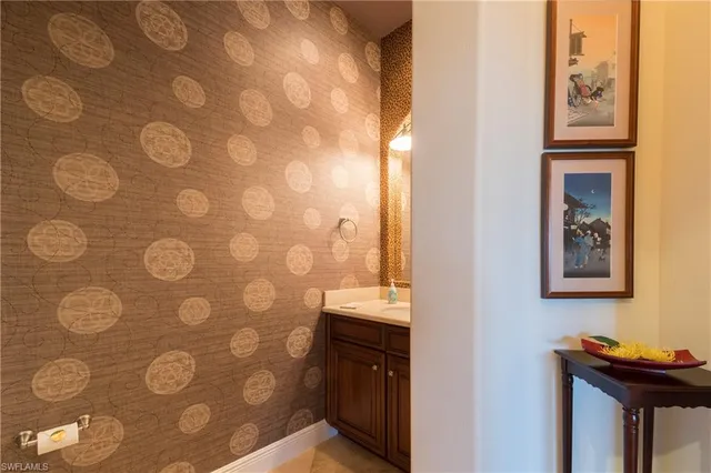 a bathroom with a sink and a shower curtain