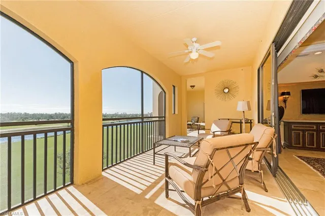 a view of balcony with furniture