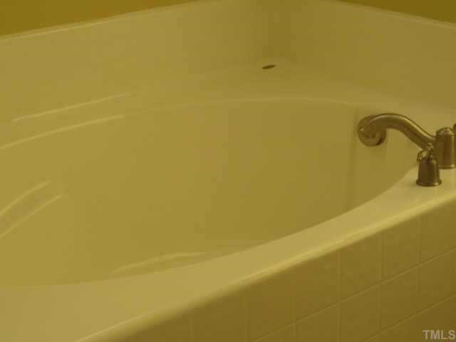 3811 Lunceston Way, Unit 307 Raleigh, NC 27613 - Photo 8 of 10 Of course this quality built condo would not be complete without the garden tub and seperate glass shower, dual vanity and italian tile floors. Other